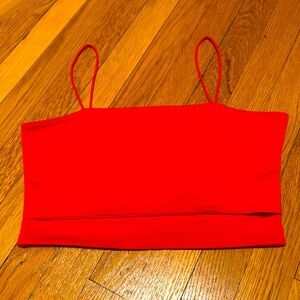 Stain in back but can be washed out i beleive. Red cutout tank